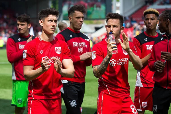 Bristol City Players Callum O'Dowda and Josh Brownhill Celebrate with Fans at Ashton Gate Stadium after Securing Sky Bet Championship Promotion