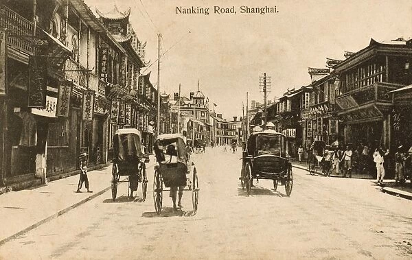 China - Shanghai - Nanjing Road - Rickshaws and shops