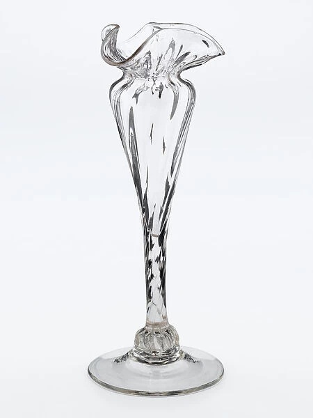 Vase. One of two clear glass vases with a spreading foot