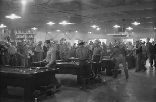 Construction workers playing pool in company commissary, Sha