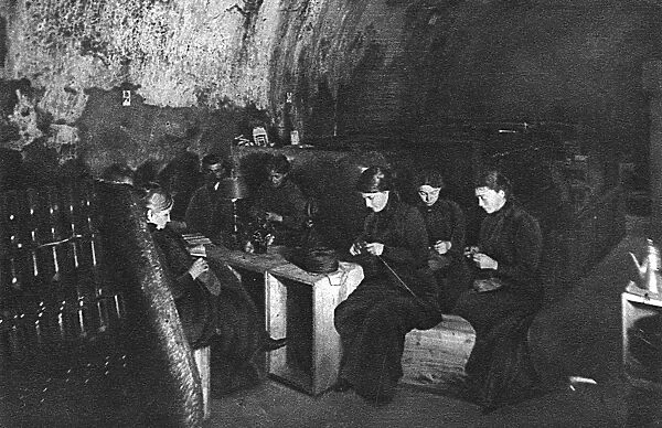 French women knitting in wine cellar, Rheims, WW1