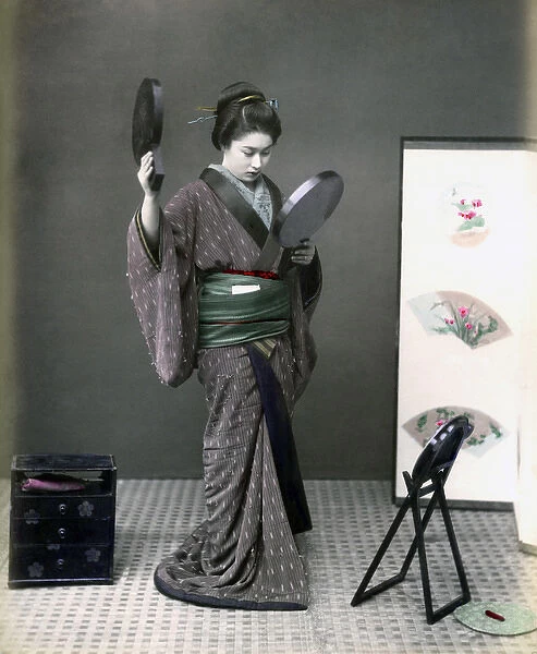 Geisha with kimono and two mirrors, Japan, circa 1880s