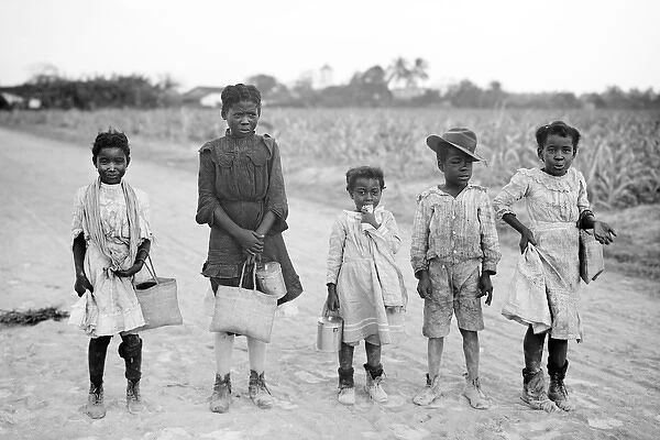 A group of African-American children on a country road in Am