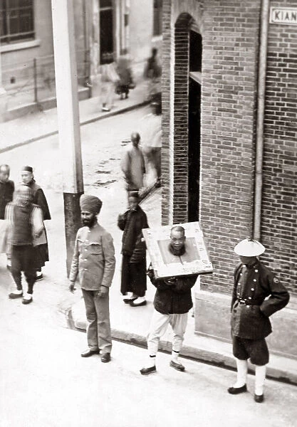 Man in a cangue circa 1900, China. Date: circa hina
