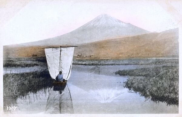 Mount Fuji, Japan - A small sailing boat crosses wetlands