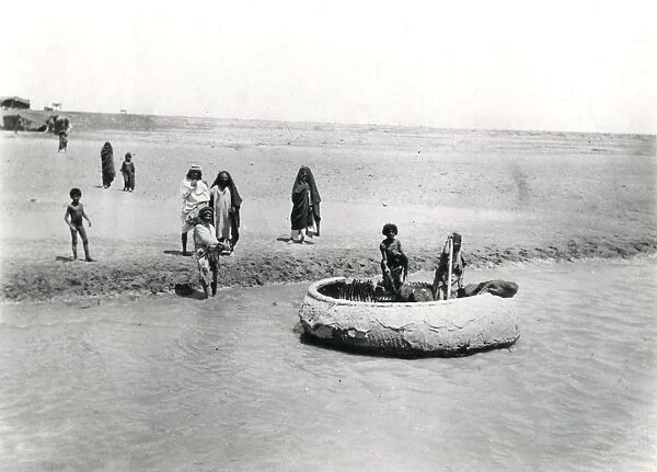 Natives with boat on the Tigris near Baghdad, Iraq