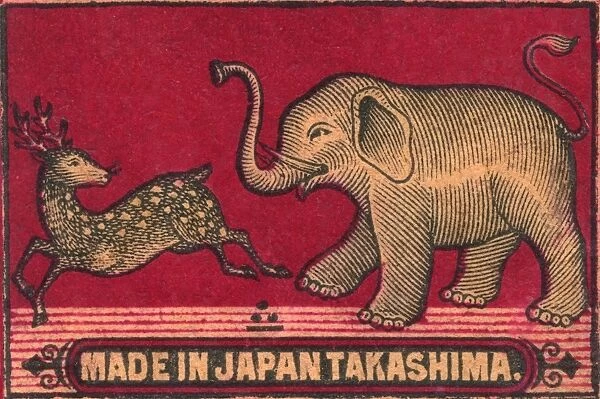 Old Japanese Matchbox label with an elephant chasing a deer