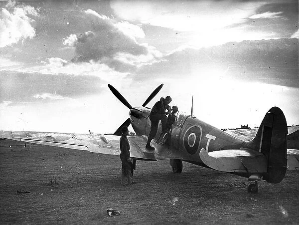 A pilot is about to climb into his Supermarine Spitfire IX