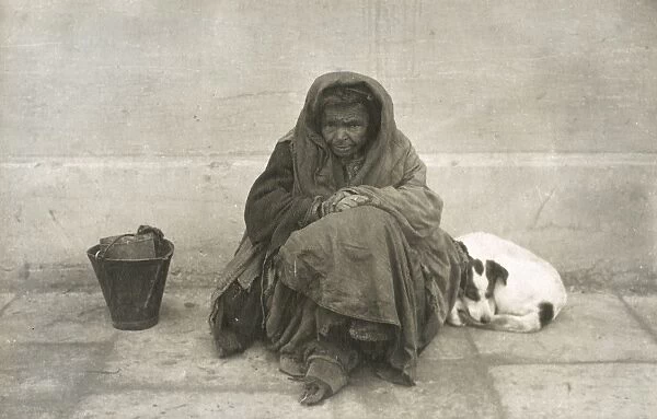 Poor Macedonian Beggar Woman and her dog