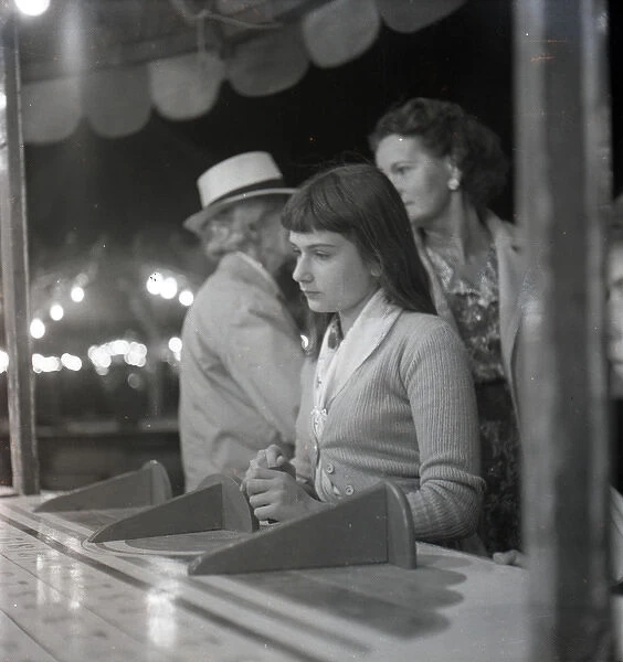 Sad-looking girl at the fair