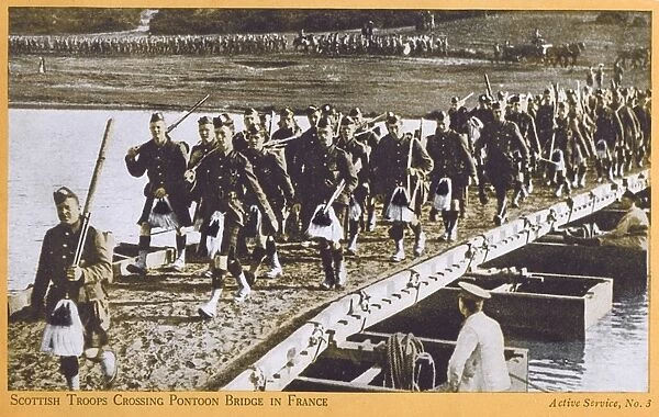 Scottish troops cross a pontoon bridge in France - WWI