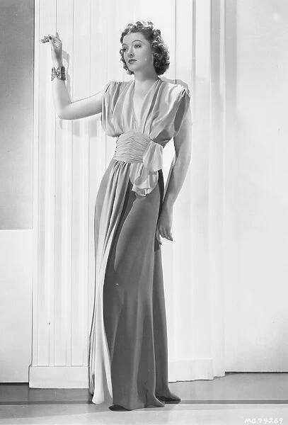 A stylish evening gown designed by Dolly Tree for Myrna Loy