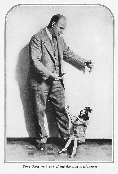 Tony Sarg and one of his dancing marionettes, 1928