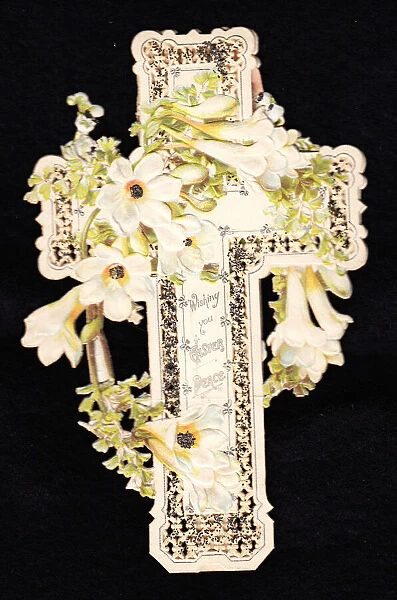White flowers on a cross-shaped Easter card