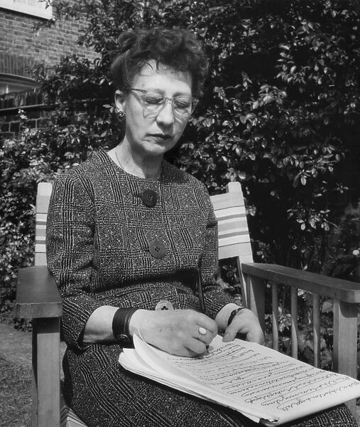 Woman doing automatic writing in a garden