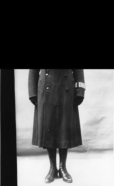 Woman police officer in overcoat, London