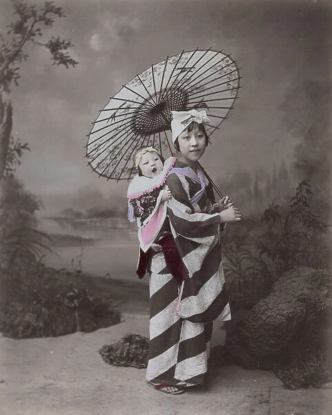 Young woman or nurse  /  nanny carrying a baby, Japan