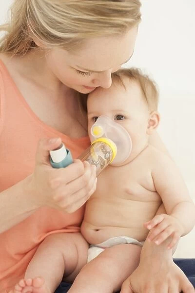 Baby using an inhaler F008  /  3019