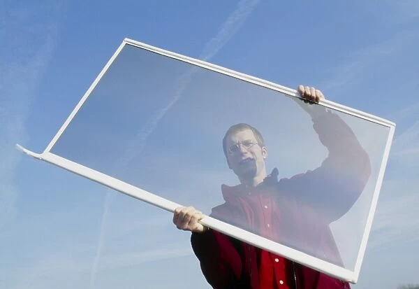 Man holding a transparent gasotrope window