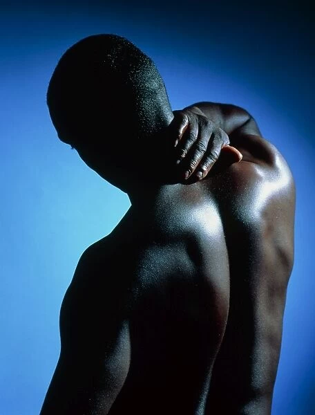 Neck  /  shoulder pain: black man with hand on neck