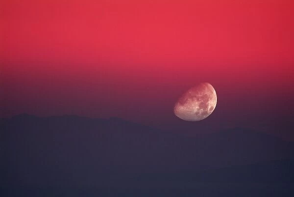Setting Moon in a red sky