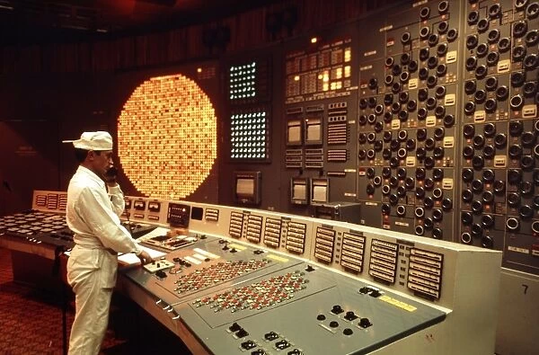 Worker in a control room of nuclear power station