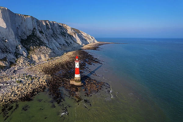 Aerial view of the Beachy Head Lighthouse at low tide, Seven Sisters chalk cliffs, South Downs National Park, East Sussex, England, United Kingdom