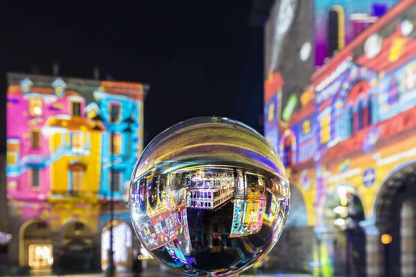 Christmas illuminations of Piazza Duomo reflected into a crystal ball, Como, Lombardy