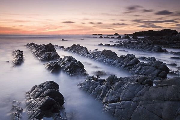 Twilight from the rocky shores of Hartland Quay in North Devon, England. Autumn