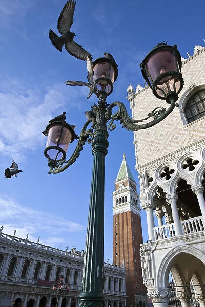 A typical lamp post in Saint Marks Square framing the Bell Tower of Saint Mark