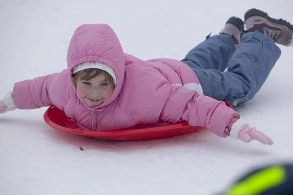 Children playing in the snow in Aviemore Scotland UK