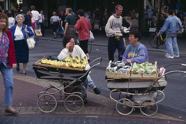 10048437. IRELAND Dublin Street traders selling fruit from prams