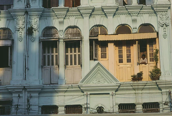 20025885. MYANMAR Yangon Detail of building facade with shuttered windows