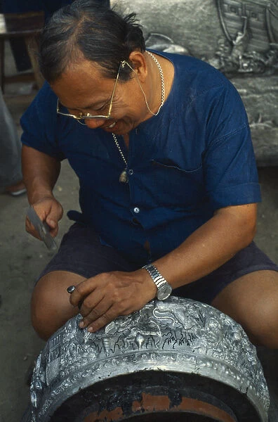 20063659. THAILAND Chiang Mai Silversmith making large silver bowl