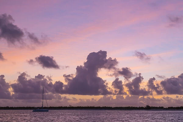 Bahamas, Exuma Island. Sailboat anchored at sunset