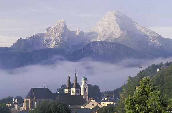 Europe, Germany, Berchtesgaden. Steeples of St. Andrews and St. Peter as mist clears