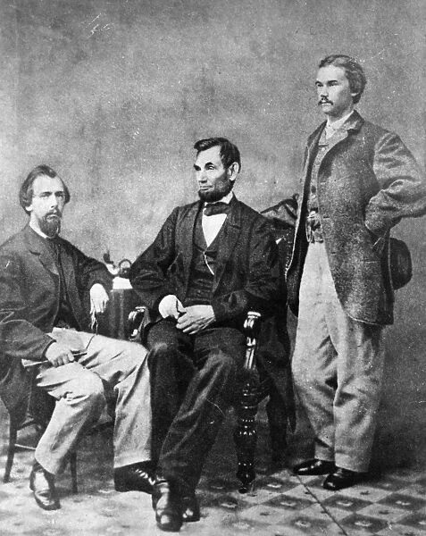 (1809-1865). 16th President of the United States. Photographed with his secretaries John M. Hay (standing) and John G. Nicolay by Alexander Gardner, 8 November 1863