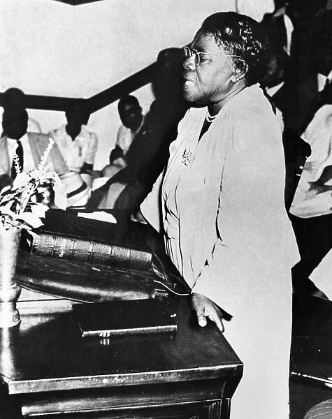 (1875-1955). American educator and civil rights leader, preaching in a church. Undated photograph
