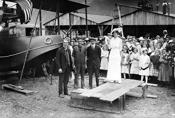 (1878-1930). American inventor and aviator. With John Cyril Porte, George E. A. Hallett, and Katherine Masson at the christening of the Curtiss Model H flying boat America in Hammondsport, New York. Photograph, 22 June 1914