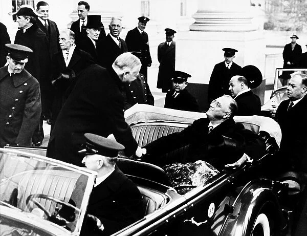(1882-1945). 32nd President of the United States. President-elect Roosevelt shaking hands with outgoing President Hoover on the way to his inauguration, 4 March 1933