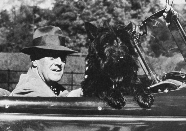 (1882-1945). 32nd President of the United States. Roosevelt photographed with his Scottish Terrier, Fala, c1944