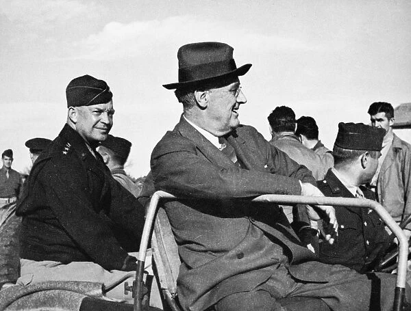 (1882-1945). 32nd President of the United States. Reviewing Allied troops in Sicily, Italy, during World War II with General Dwight D. Eisenhower (left), 1943