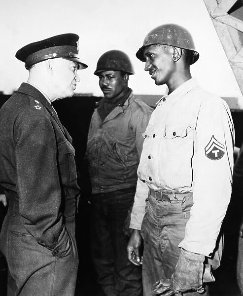 (1890-1969). 34th President of the United States. Eisenhower talking to T  /  5 William Carpenter of Nashville while on a tour of Cherbourg, France, in June 1944