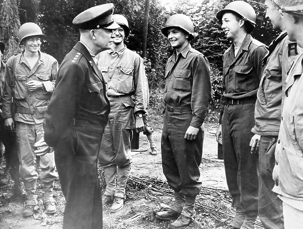 (1890-1969). 34th President of the United States. Eisenhower pausing to talk to soldiers in France, 26 July 1944