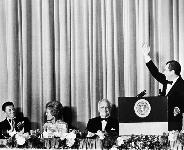 37th President of the United States. President Nixon (at podium) at a fundraising dinner for the Republican Party in Los Angeles with Governor Ronald Reagan (far left), First Lady Patricia Nixon, and Edward W. Carter. Photographed 1972
