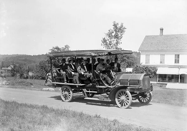 ADIRONDACKS, c1910. A tour bus on the road in the Adirondack Mountains. Photograph