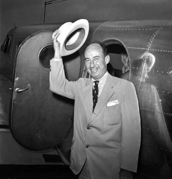 ADLAI STEVENSON (1900-1965). American lawyer and political leader. Arriving in Chicago, Illinois, for the Democratic National Convention, July 1952. Photographed by Thomas J. O Halloran