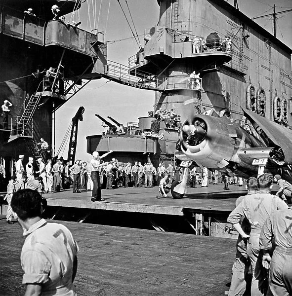AIRCRAFT CARRIER, c1943. Activity onboard an American aircraft carrier. Photograph