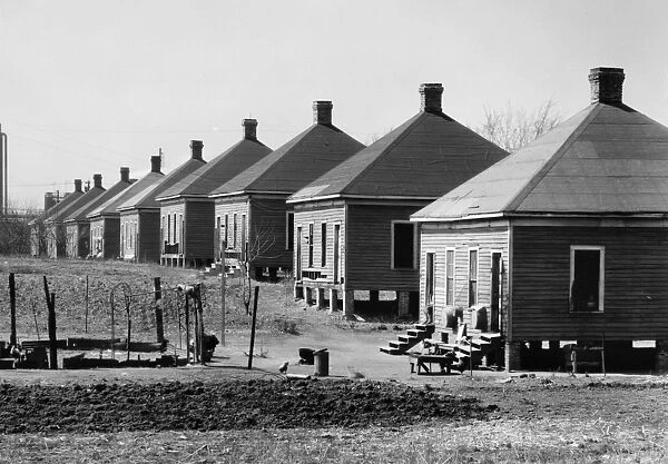 ALABAMA: HOUSING, 1936. Steelmill workers company housing with outhouses at the