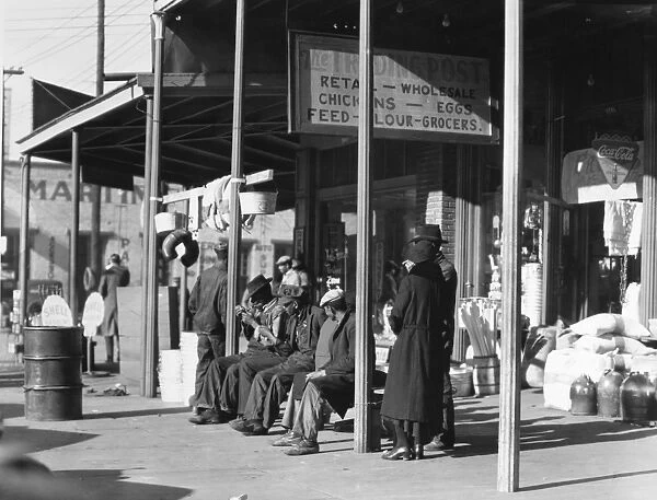 ALABAMA: SELMA, 1935. Group of people outside a general store in Selma, Alabama